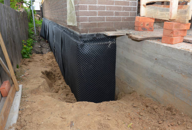 Happy homeowners after waterproofing job in Melrose Park